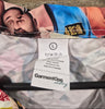 GarmentOne clothing care label showing size Large with wash instructions – WWE wrestling scrub top"