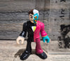 DC Imaginext Two-Face Front view with the iconic split black tuxedo/pink suit and half-scarred teal face